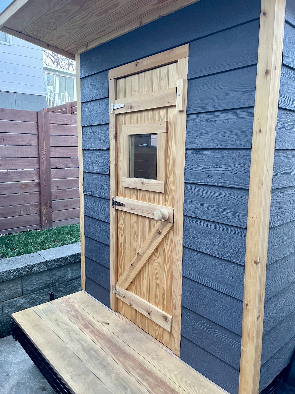 Handcrafted cedar door detail on a Bushlot Sauna Club mobile sauna
